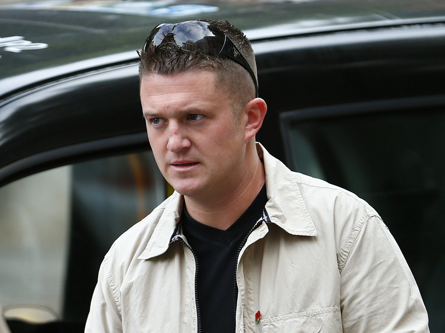 English Defence League leader Tommy Robinson arrives at Westminster Magistrates' Court in London